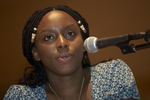 Photo of Chimamanda Ngozi Adichie speaking at "From Apartheid to Darfur: Africa's Struggle Against Disdain" in 2007 at Black Mountain Institute. by Black Mountain Institute